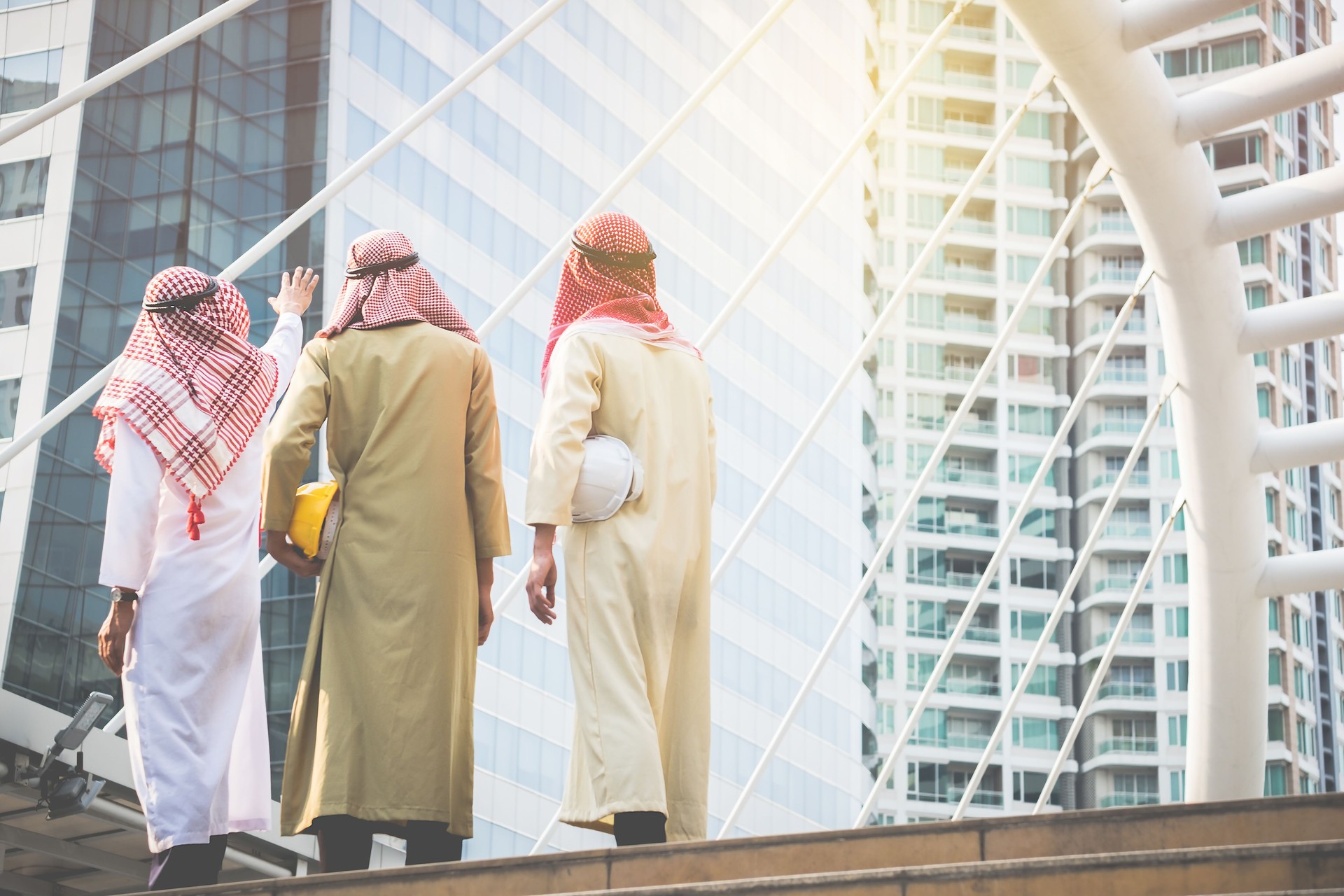 Arab businessmen and architects convene to work together for a common goal and success.Business Concept